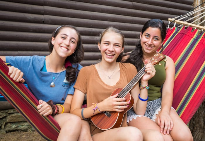 Girls on hammock with instrument