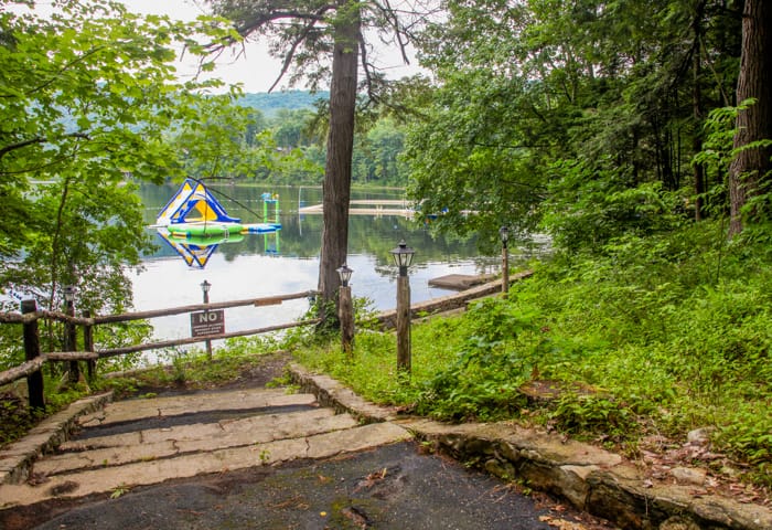 Waterfront framed by trees and walkway