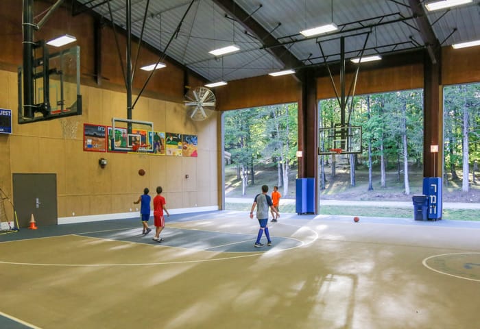 Indoor basketball court with players